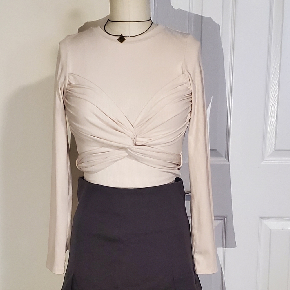 Wrap styled ribbed top in cream